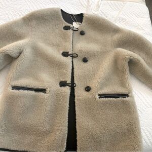 Faux fur coat. New with tags. Color Ecru. Size Medium